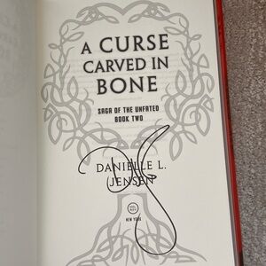 A Curse Carved in Bone Book (SIGNED)